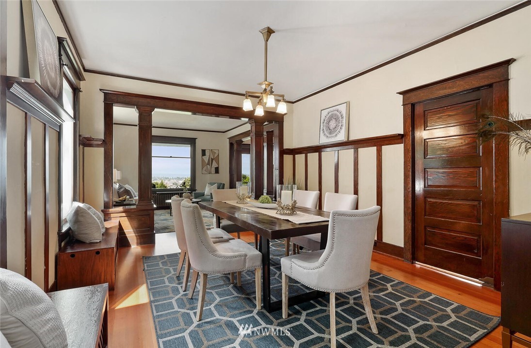 5124 1st Avenue Northwest Seattle, WA 98103 - Photo 8 of 35 a dining room with furniture window and wooden floor