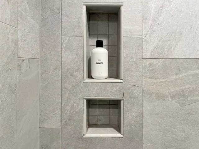 a en suite bathroom with a sink and a mirror