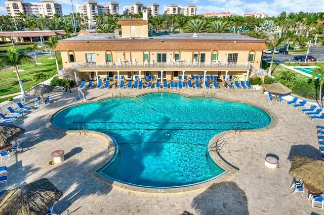 an aerial view of a pool patio swimming pool and outdoor seating