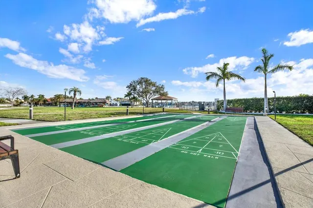 a view of a swimming pool with outdoor seating