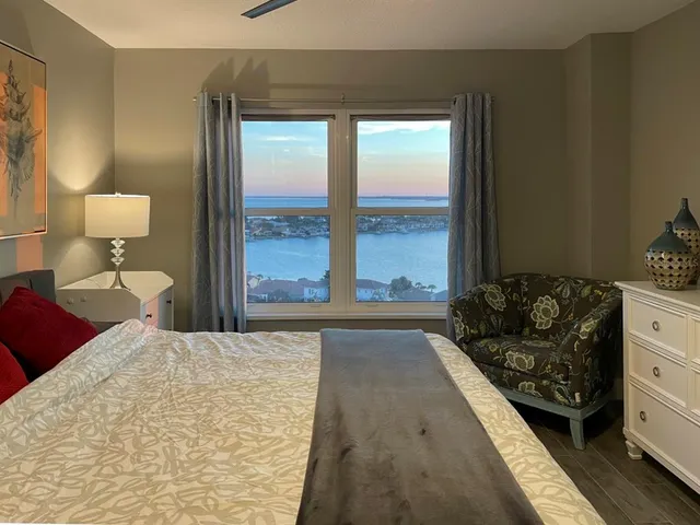 a bedroom with a bed and window