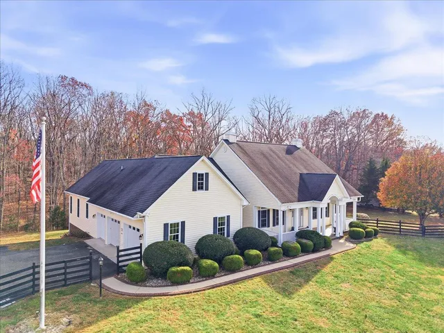 a view of house with yard and entertaining space
