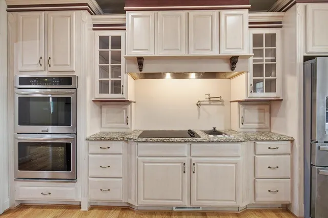 a bathroom with a shower a toilet and a sink