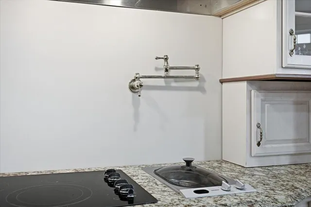 a bathroom with a sink and mirror