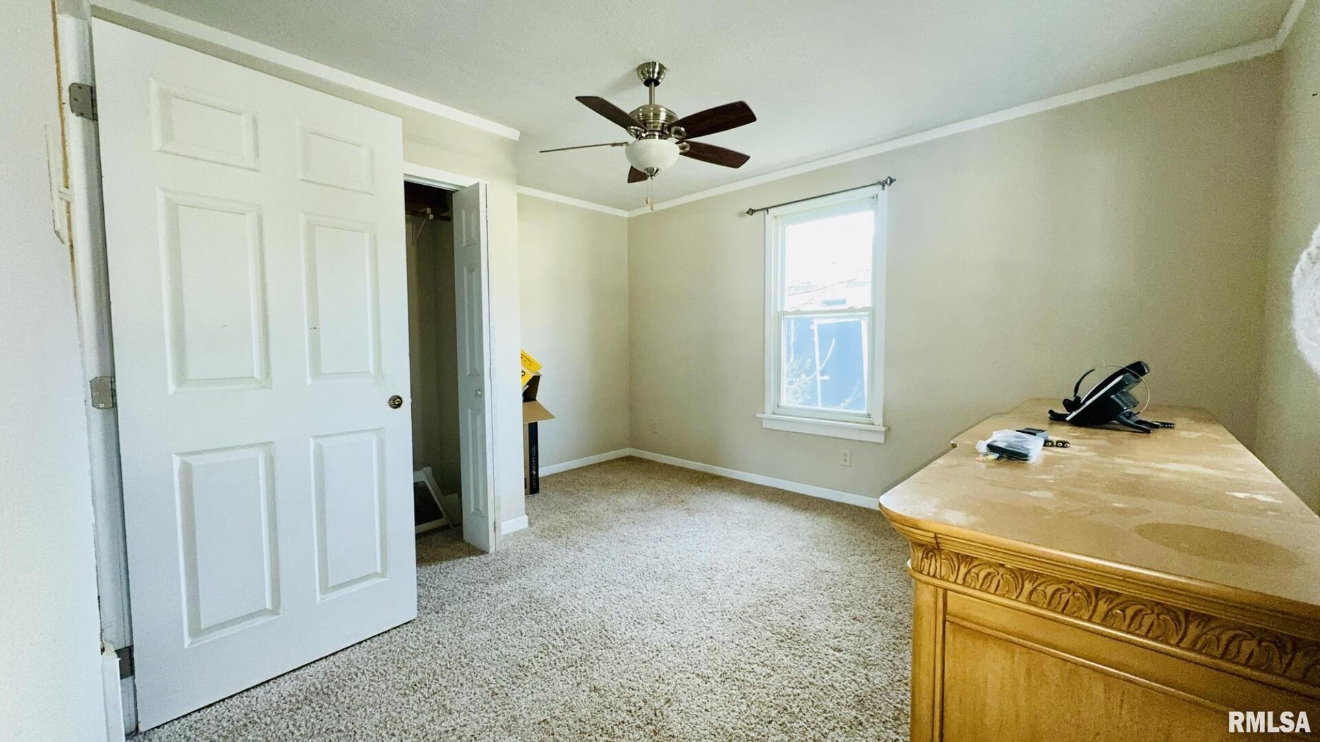 720 East Taylor Street Benton, IL 62812 - Photo 17 of 19 a very nice looking room with a ceiling fan