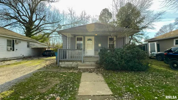 a view of house and yard with green space