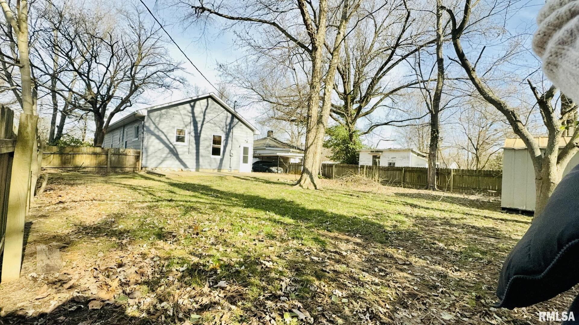 720 East Taylor Street Benton, IL 62812 - Photo 4 of 19 a view of road with large trees