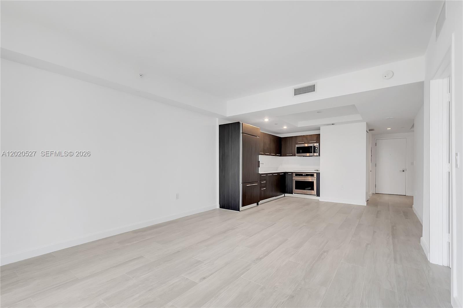 45 Southwest 9th Street, Unit 2105 Miami, FL 33130 - Photo 7 of 27 a view of an empty room with a fireplace