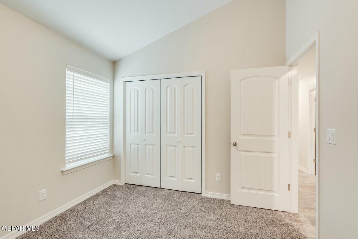 6058 Fall Ridge Street Sunland Park, NM 88008 - Photo 13 of 26 an empty room with windows