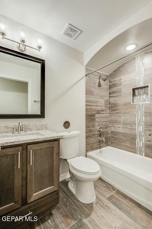 6058 Fall Ridge Street Sunland Park, NM 88008 - Photo 16 of 26 a bathroom with a toilet sink and a mirror