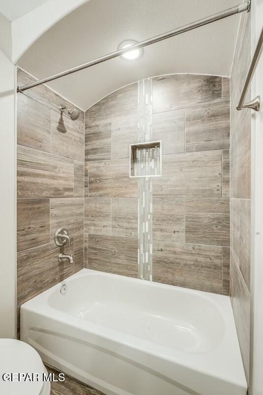 6058 Fall Ridge Street Sunland Park, NM 88008 - Photo 17 of 26 a bathroom with a white bathtub and a shower