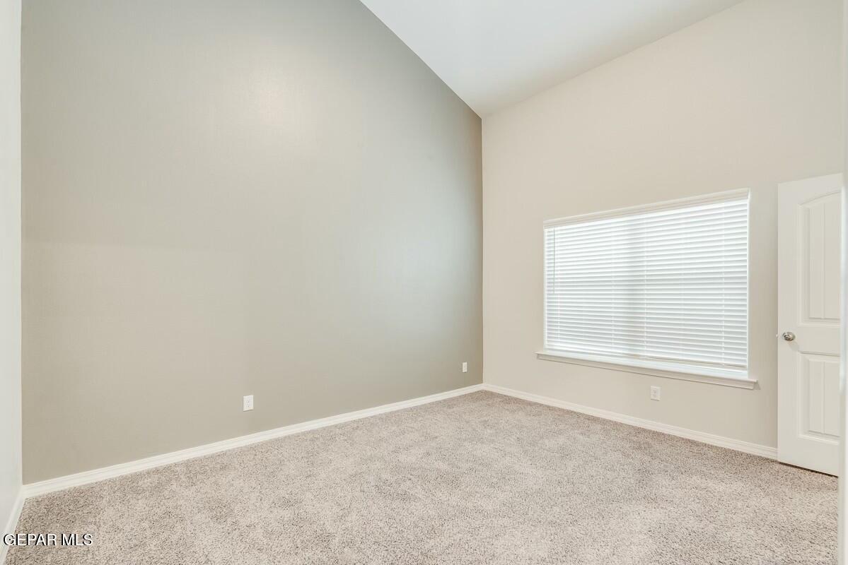 6058 Fall Ridge Street Sunland Park, NM 88008 - Photo 20 of 26 an empty room with a window