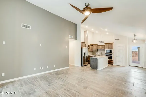 a view of a kitchen with a sink and cabinets