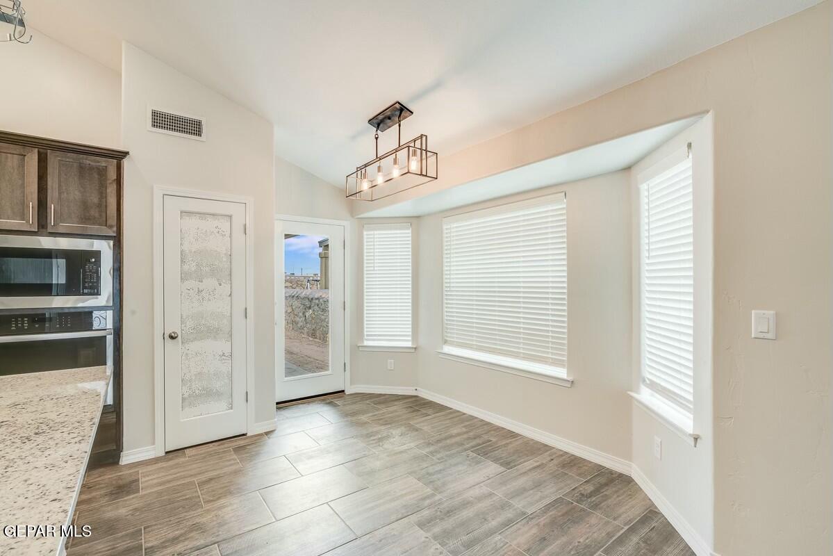 6058 Fall Ridge Street Sunland Park, NM 88008 - Photo 7 of 26 a view of an empty room with closet and a window