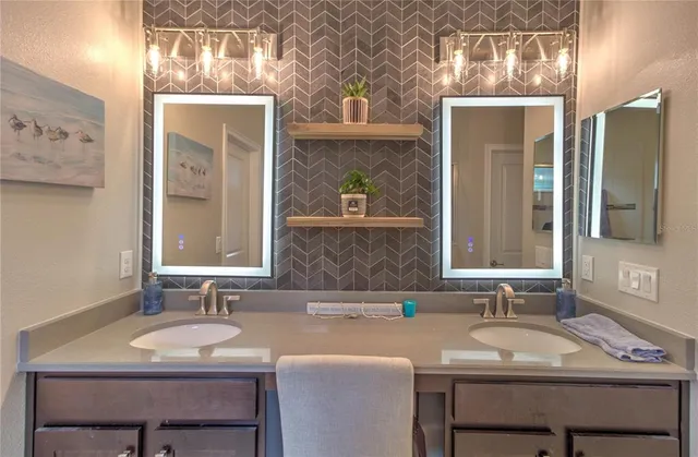 a bathroom with a sink and a mirror