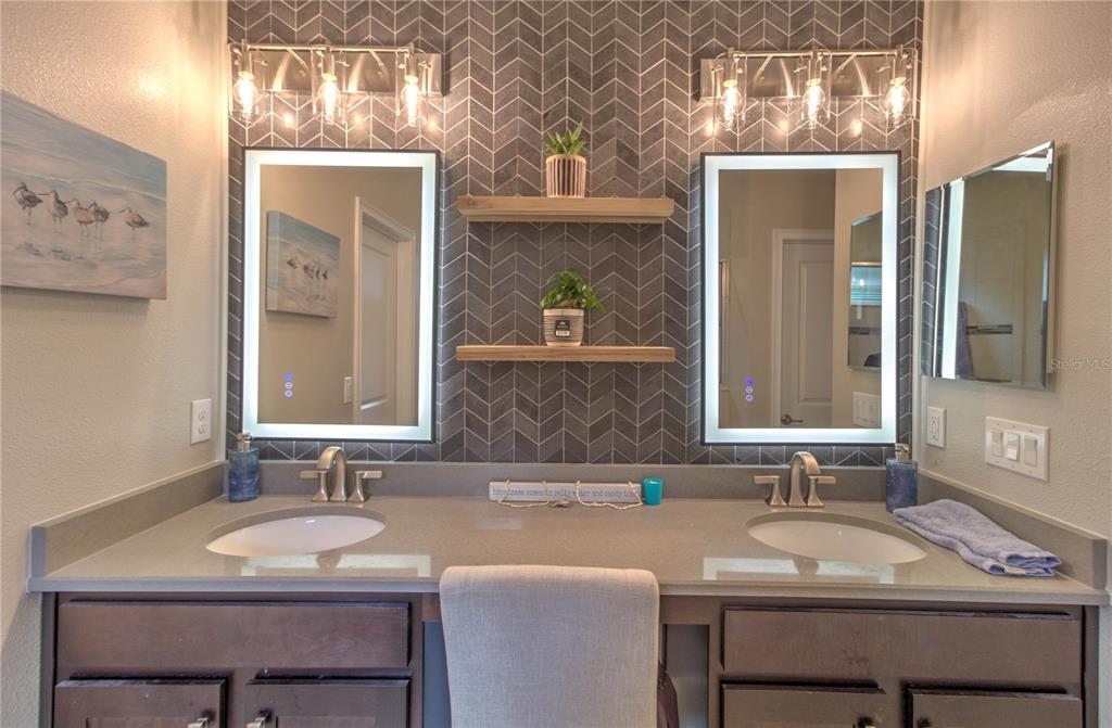 19744 Fort King Run Brooksville, FL 34601 - Photo 25 of 44 a bathroom with a sink and a mirror