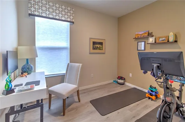 a room that has a table and a chair in it