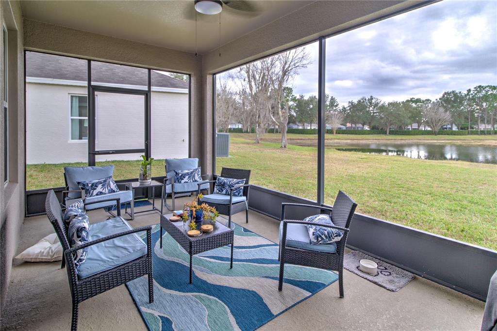 19744 Fort King Run Brooksville, FL 34601 - Photo 32 of 44 a outdoor space with furniture and a lake view