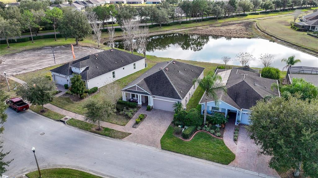 19744 Fort King Run Brooksville, FL 34601 - Photo 35 of 44 an aerial view of a house with garden space and lake view