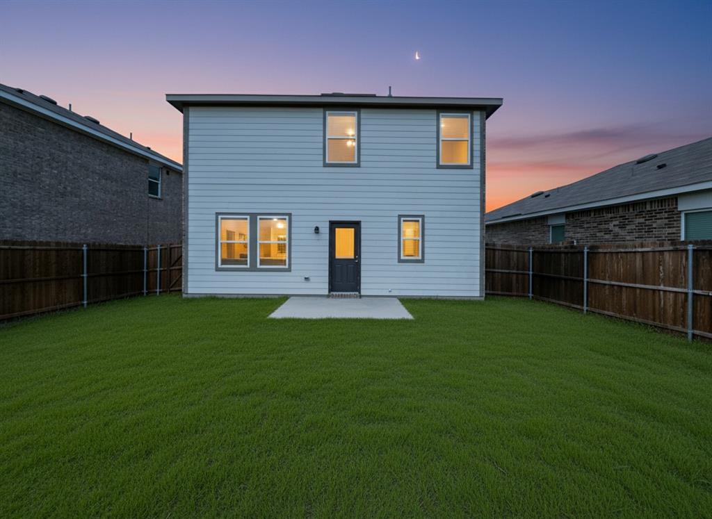 6114 Harrah Lane Forney, TX 75126 - Photo 6 of 10 a front view of a house with a garden