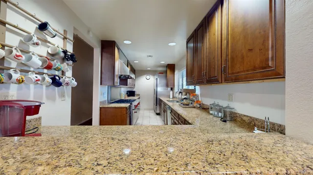 a very nice looking dining room with furniture window and outside view