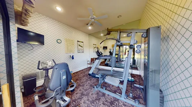 a living room with furniture a window and a table