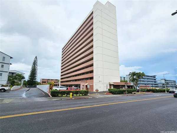 a tall building sitting on the side of a street