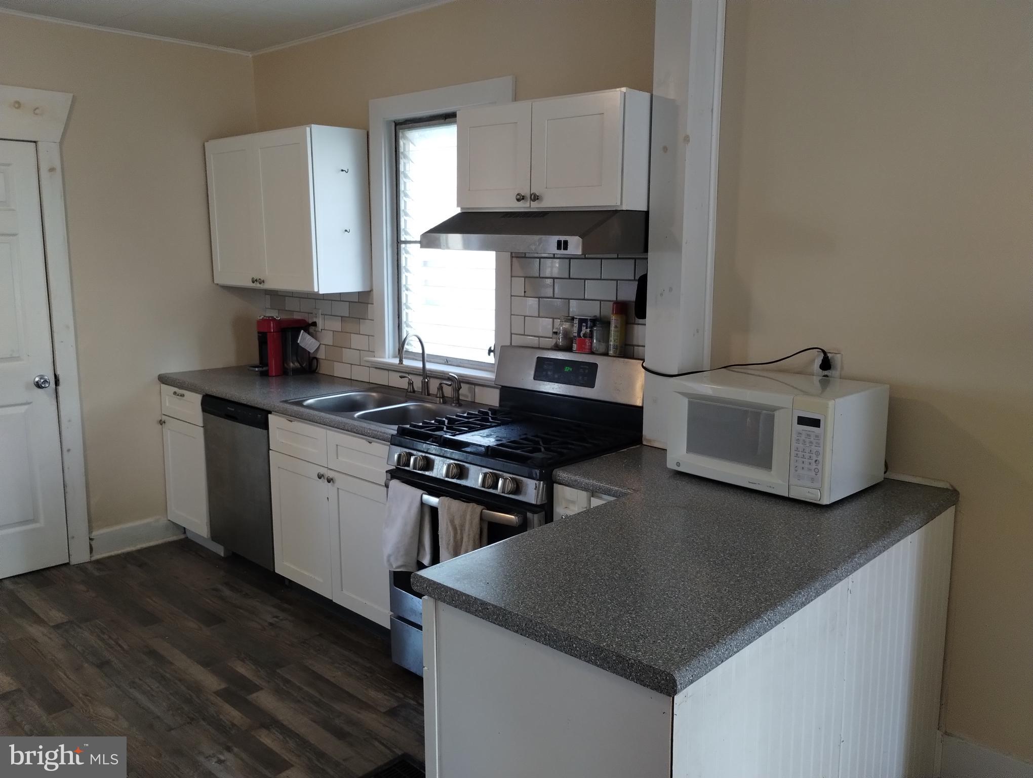 335 East Main Street Blain, PA 17006 - Photo 12 of 30 a kitchen with stainless steel appliances granite countertop a stove a sink dishwasher and a refrigerator