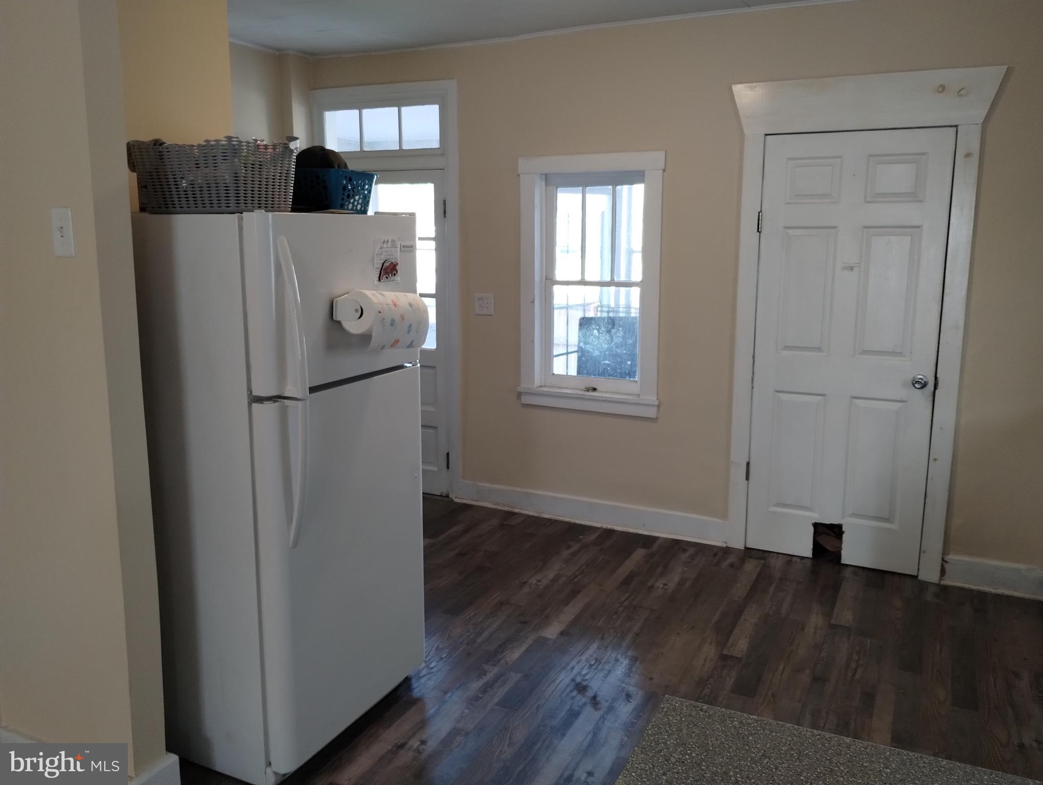 335 East Main Street Blain, PA 17006 - Photo 13 of 30 a view of a livingroom with wooden floor and a refrigerator