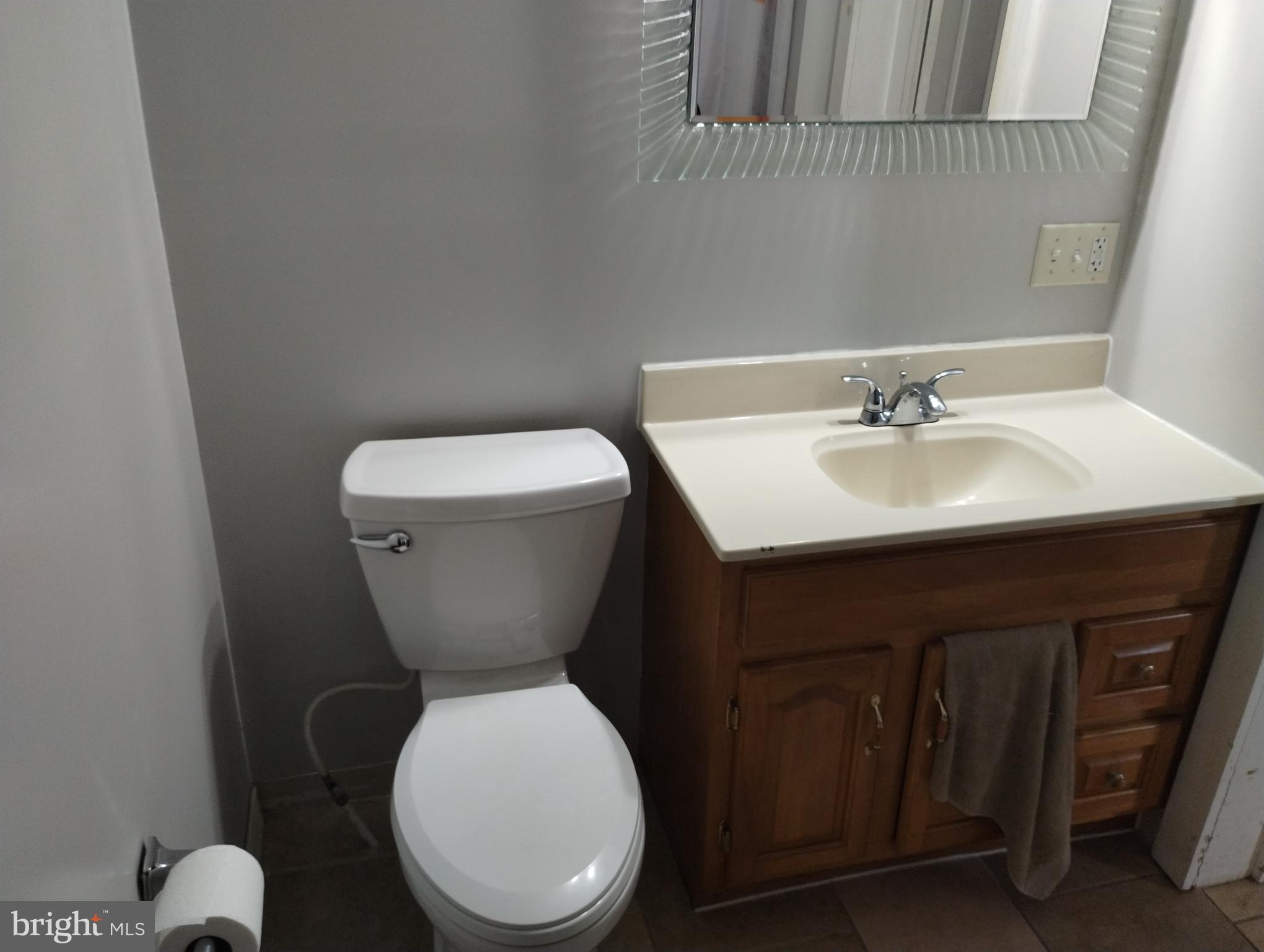 335 East Main Street Blain, PA 17006 - Photo 15 of 30 a bathroom with a toilet a sink and mirror