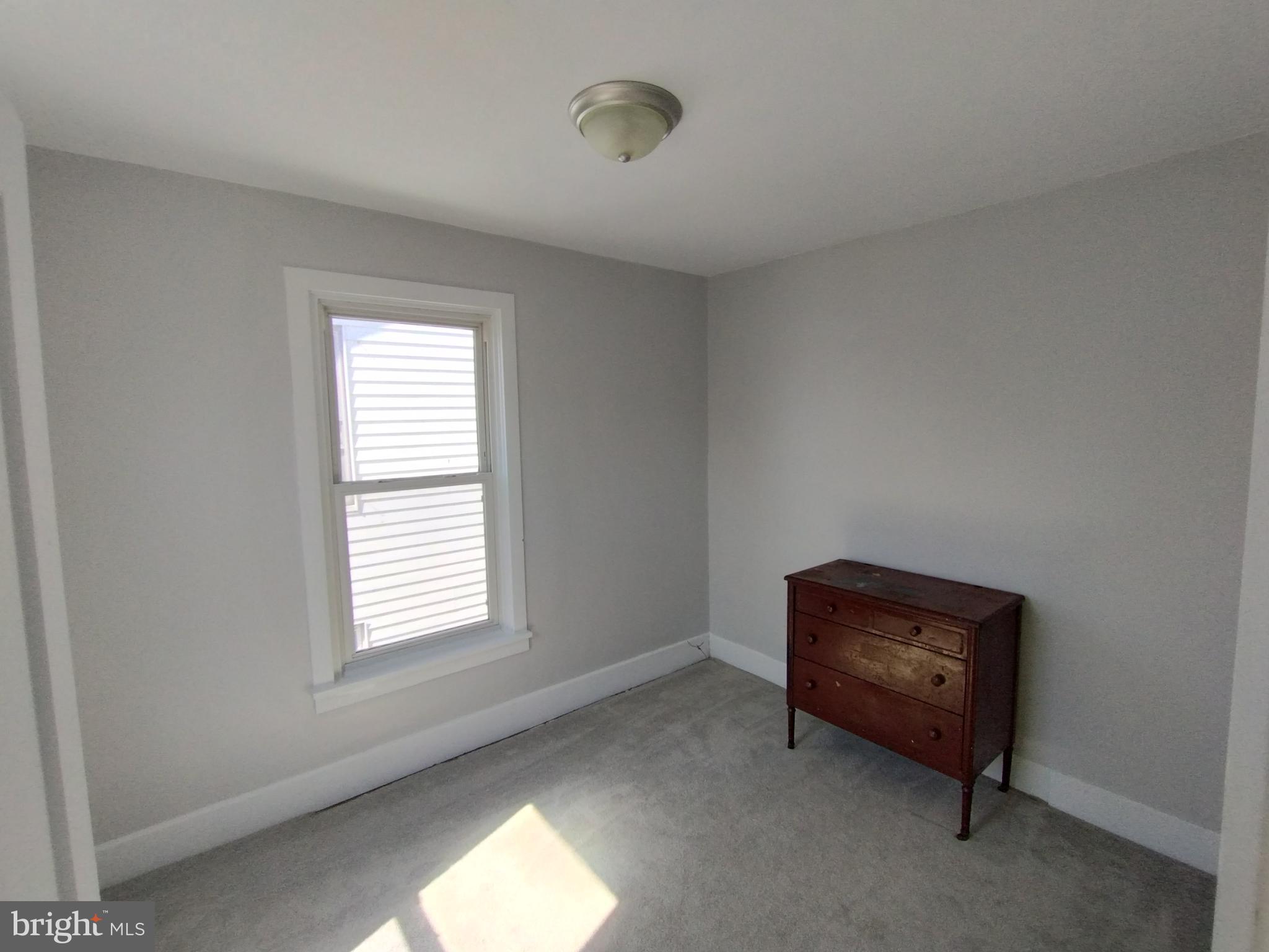 335 East Main Street Blain, PA 17006 - Photo 20 of 30 a view of an empty room with a window and a kitchen