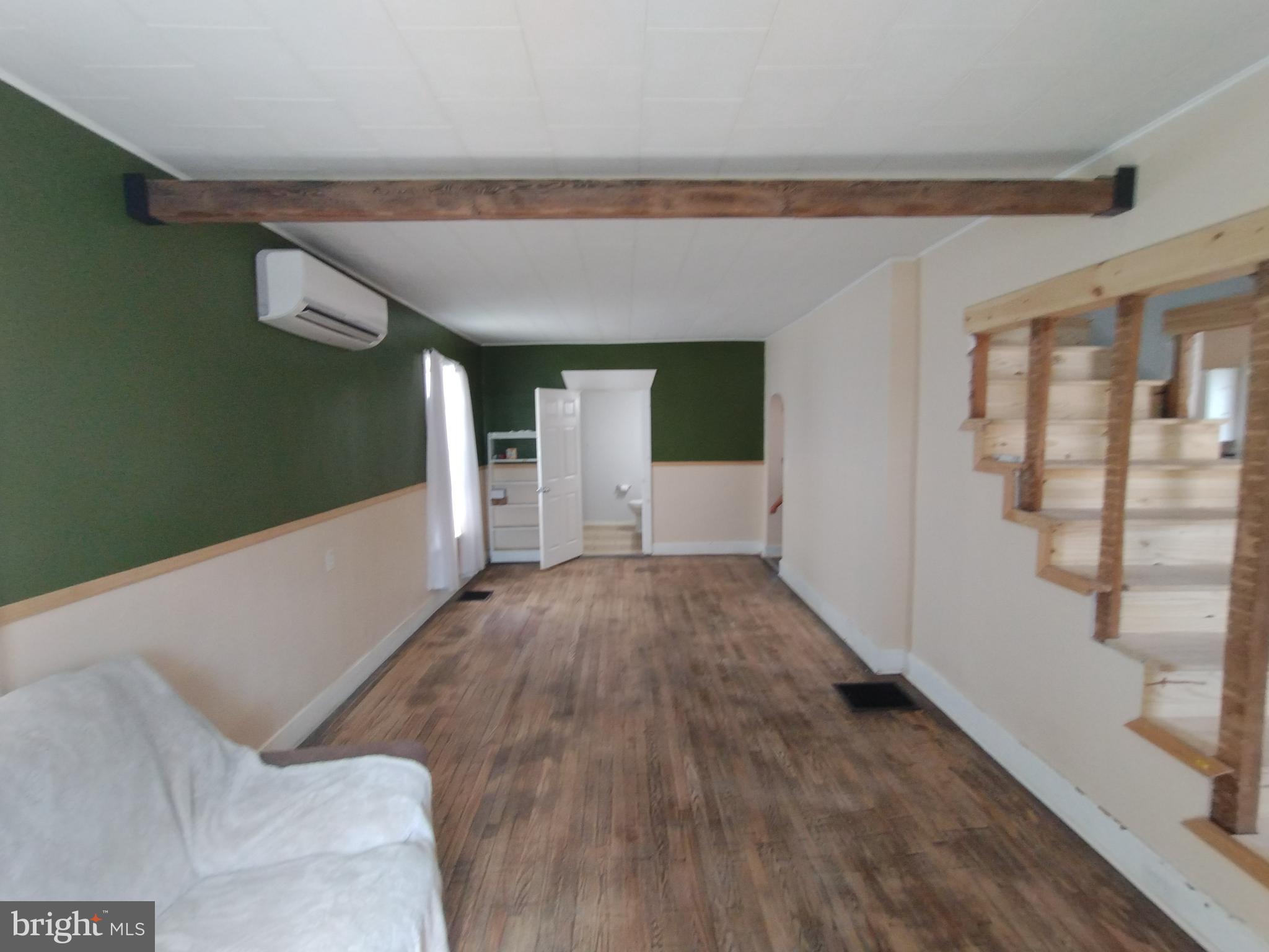 335 East Main Street Blain, PA 17006 - Photo 6 of 30 a view of empty room with wooden floor and fan