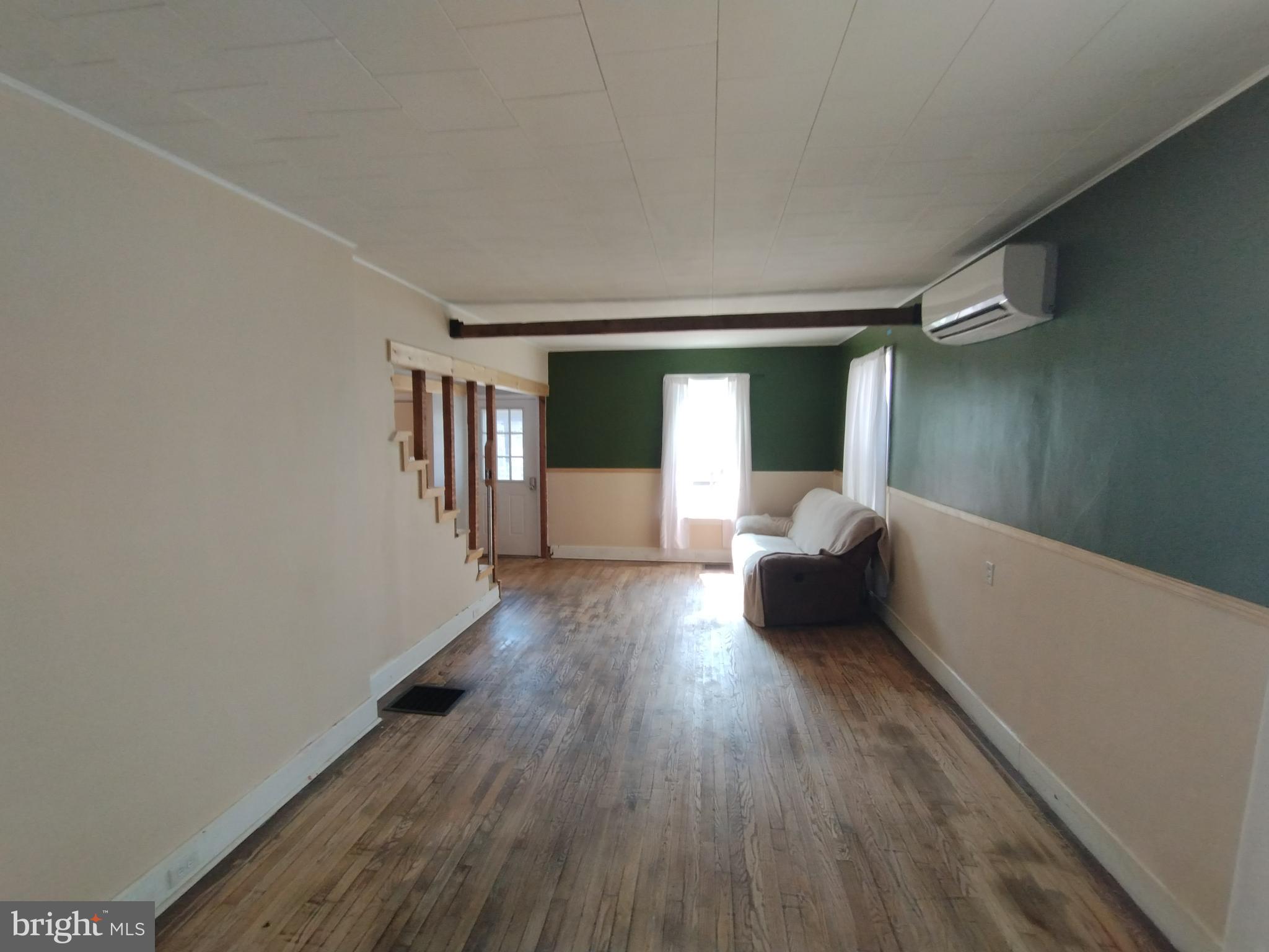 335 East Main Street Blain, PA 17006 - Photo 7 of 30 a hallway with a couches and a large window with wooden floor