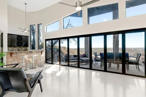 a dining room with furniture and a flat screen tv