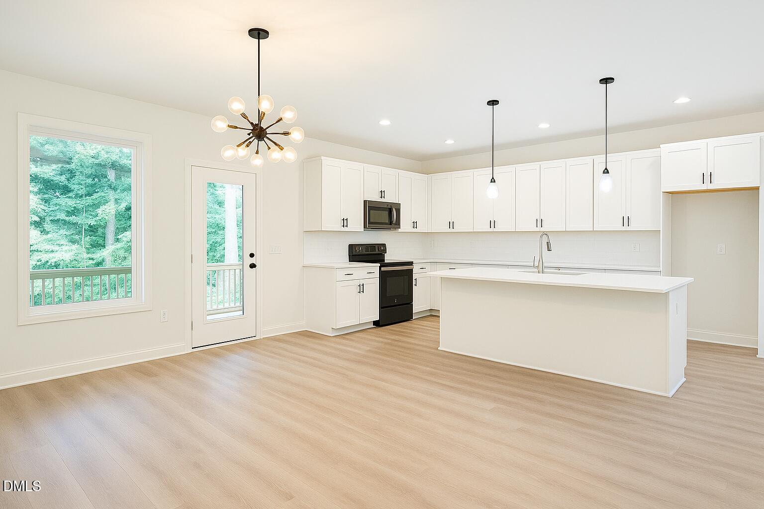 3345 Fleming Graham Road Burlington, NC 27217 - Photo 2 of 12 a kitchen with stainless steel appliances granite countertop a stove a sink dishwasher a refrigerator white cabinets and wooden floor