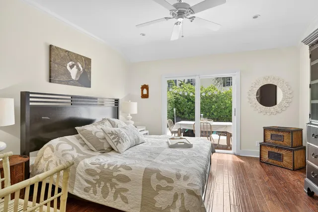 a bedroom with a bed a couch and dresser