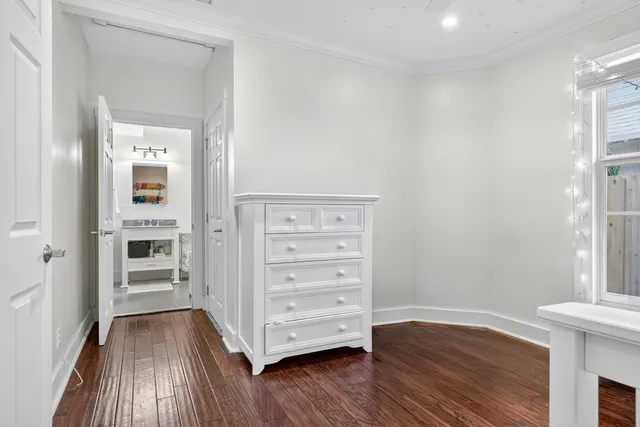 a view of walk in closet with wooden floor and closet