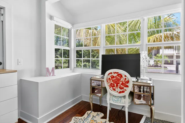 a workspace with furniture and window