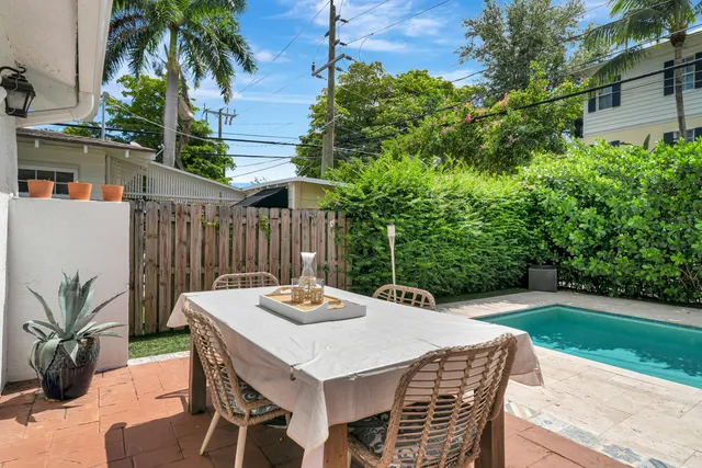 a outdoor dining space with furniture and outdoor view