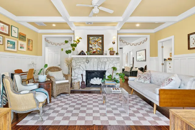 a living room with furniture and a fireplace