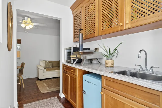 a kitchen with a sink and cabinets