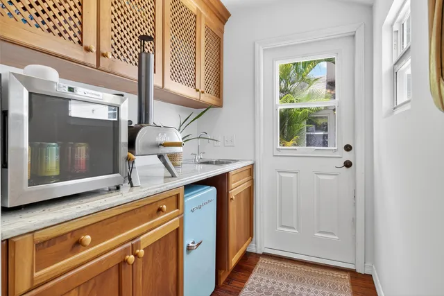 a kitchen with a sink and a window