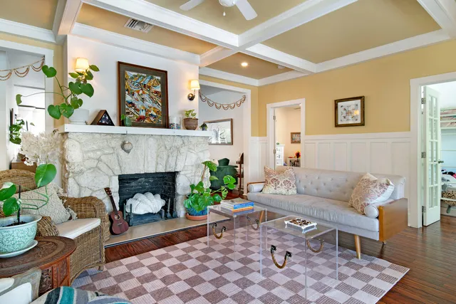 a living room with furniture and a fireplace