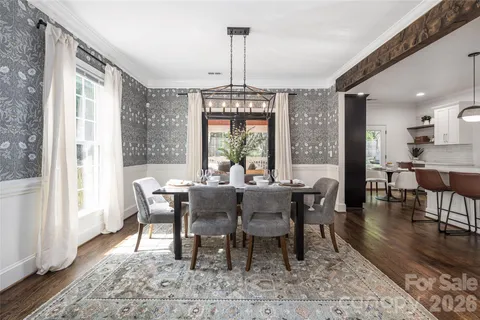 a kitchen with a dining table and chairs