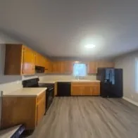 a large kitchen with a large window