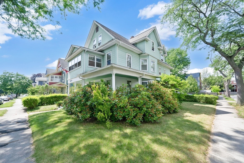 96 Garfield Street Springfield, MA 01108 - Photo 1 of 37 a front view of a house with a garden
