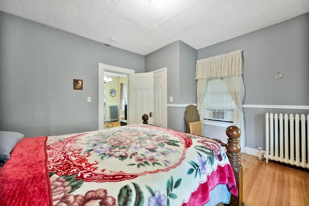 96 Garfield Street Springfield, MA 01108 - Photo 18 of 37 a bedroom with a bed and a window