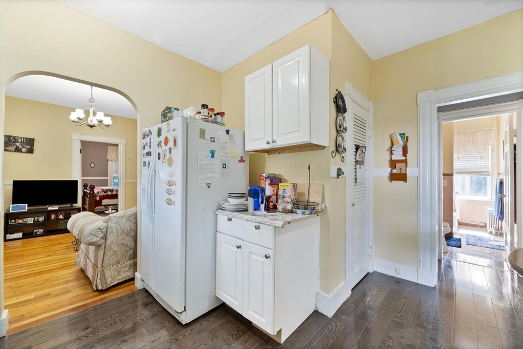 96 Garfield Street Springfield, MA 01108 - Photo 22 of 37 a kitchen with refrigerator and cabinets