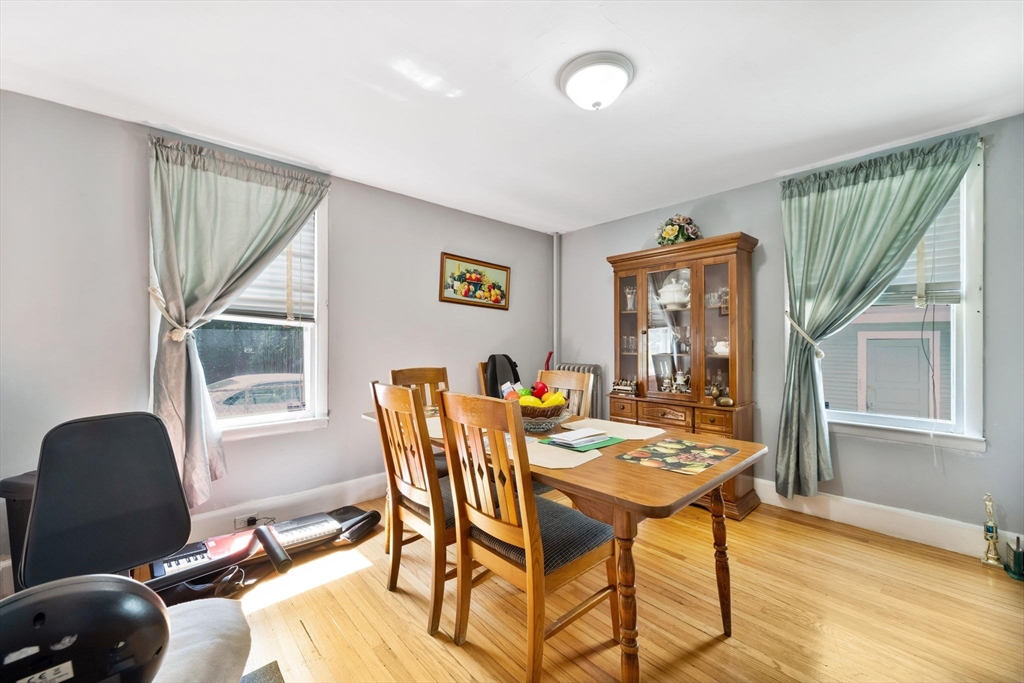 96 Garfield Street Springfield, MA 01108 - Photo 29 of 37 a view of a dining room with furniture and a window