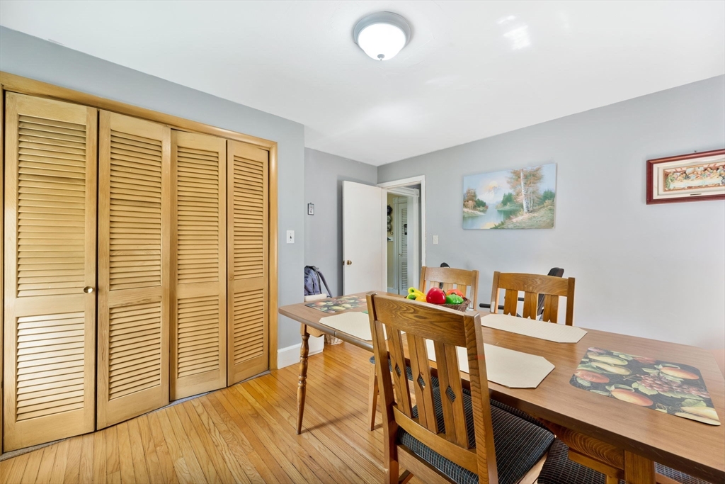 96 Garfield Street Springfield, MA 01108 - Photo 31 of 37 a view of a dining room with furniture a chandelier and wooden floor